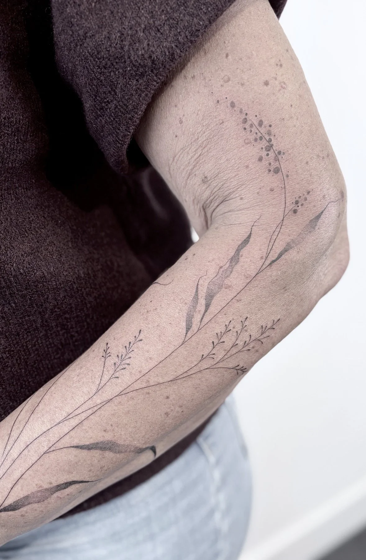 grassen onderarm tattoo fineline 