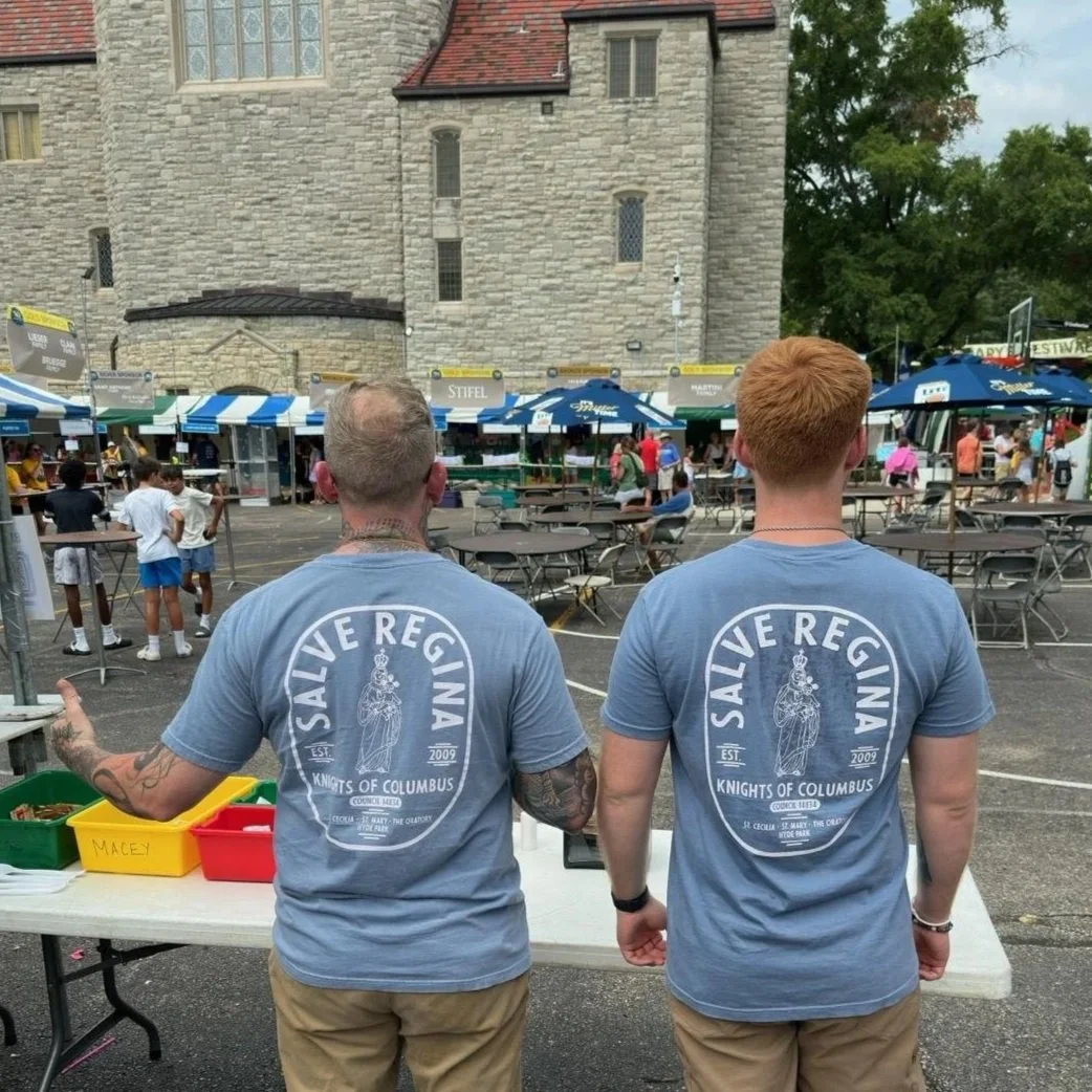 Two of our Brother Knights looking over the booths prior to the opening of FunFest 2025