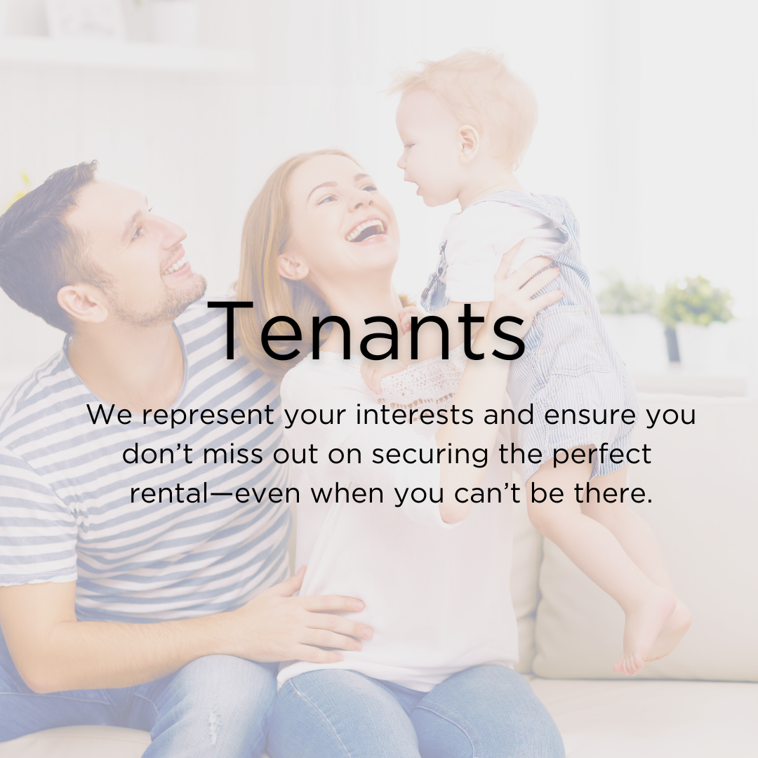 Young husband and wife smiling holding their child on the couch