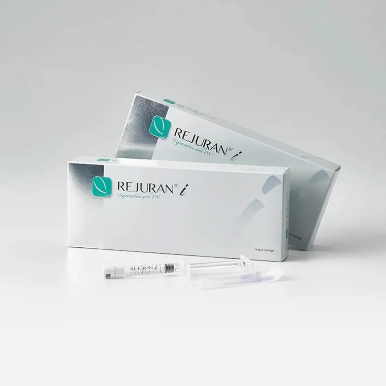 Two boxes of Rejuran skin treatment product with syringes in front, on a white background.
