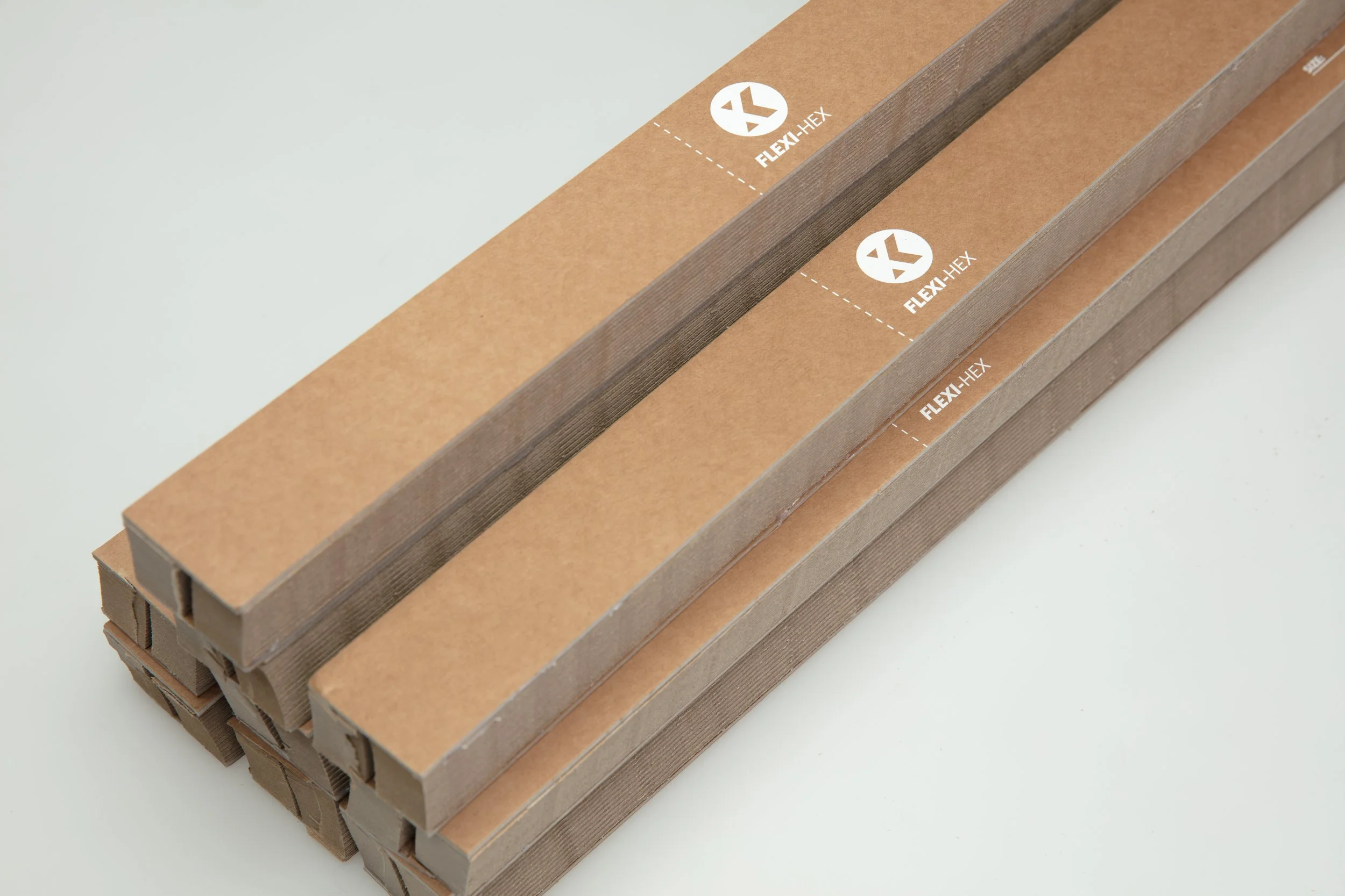 Stacked cardboard boxes labeled Flex-Hex on a light background.