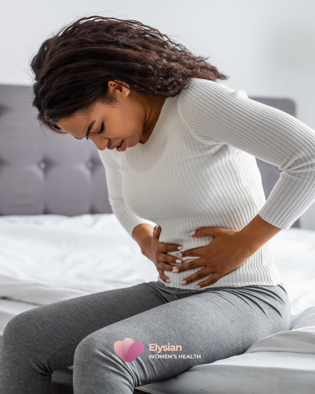 Women hunched over painful belly ovarian cyst uterine pain Australia