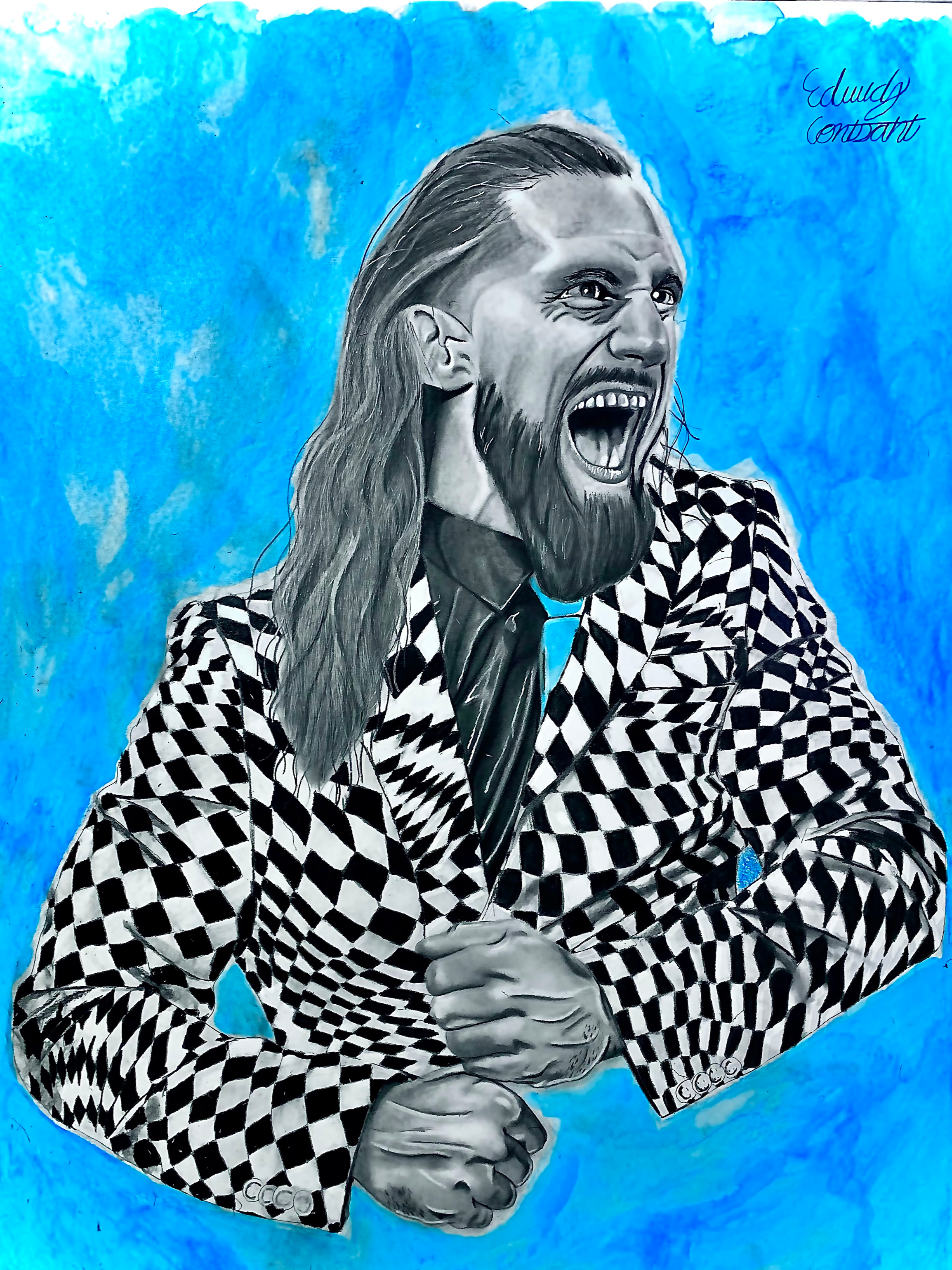 Black and white portrait of a man with long hair, a beard, and a checkered suit, seated with his right hand gripping his left wrist, against a vivid blue background. The man has an open-mouthed expression as if shouting or singing. The signature 'Edu
