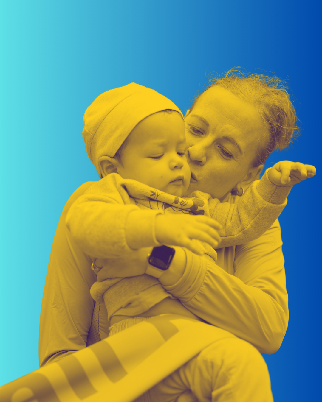 A woman is holding and kissing a young child, who has a hat and a smartwatch, against a split blue and teal background.