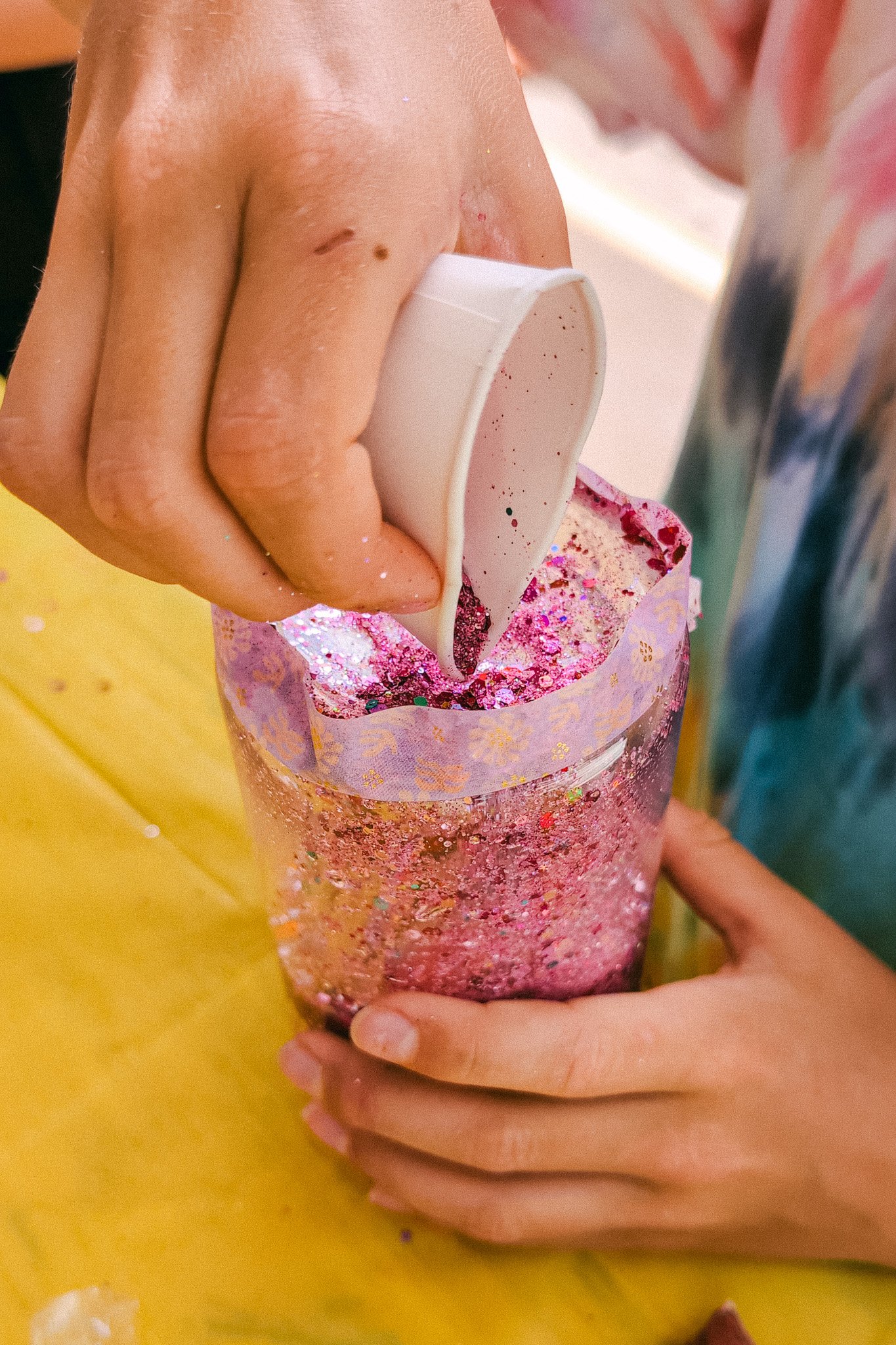 putting glitter in bottle.jpg