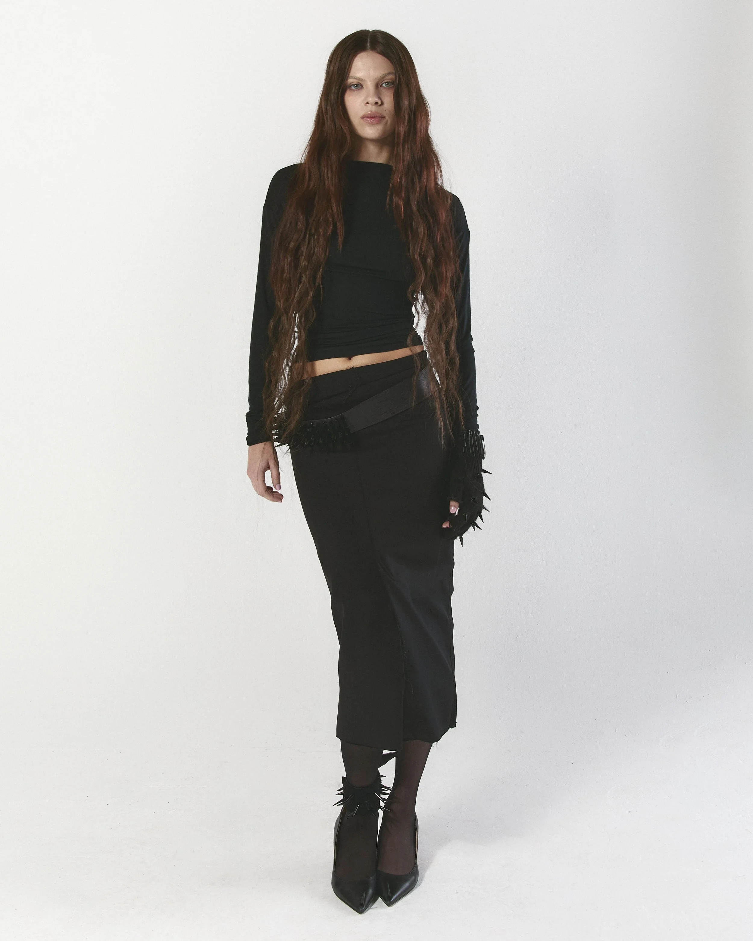 Denim pencil skirt with hook & eye closure 
Slash neck long sleeve
Hazard belt, cuff, and glove. 
Hazard pump II