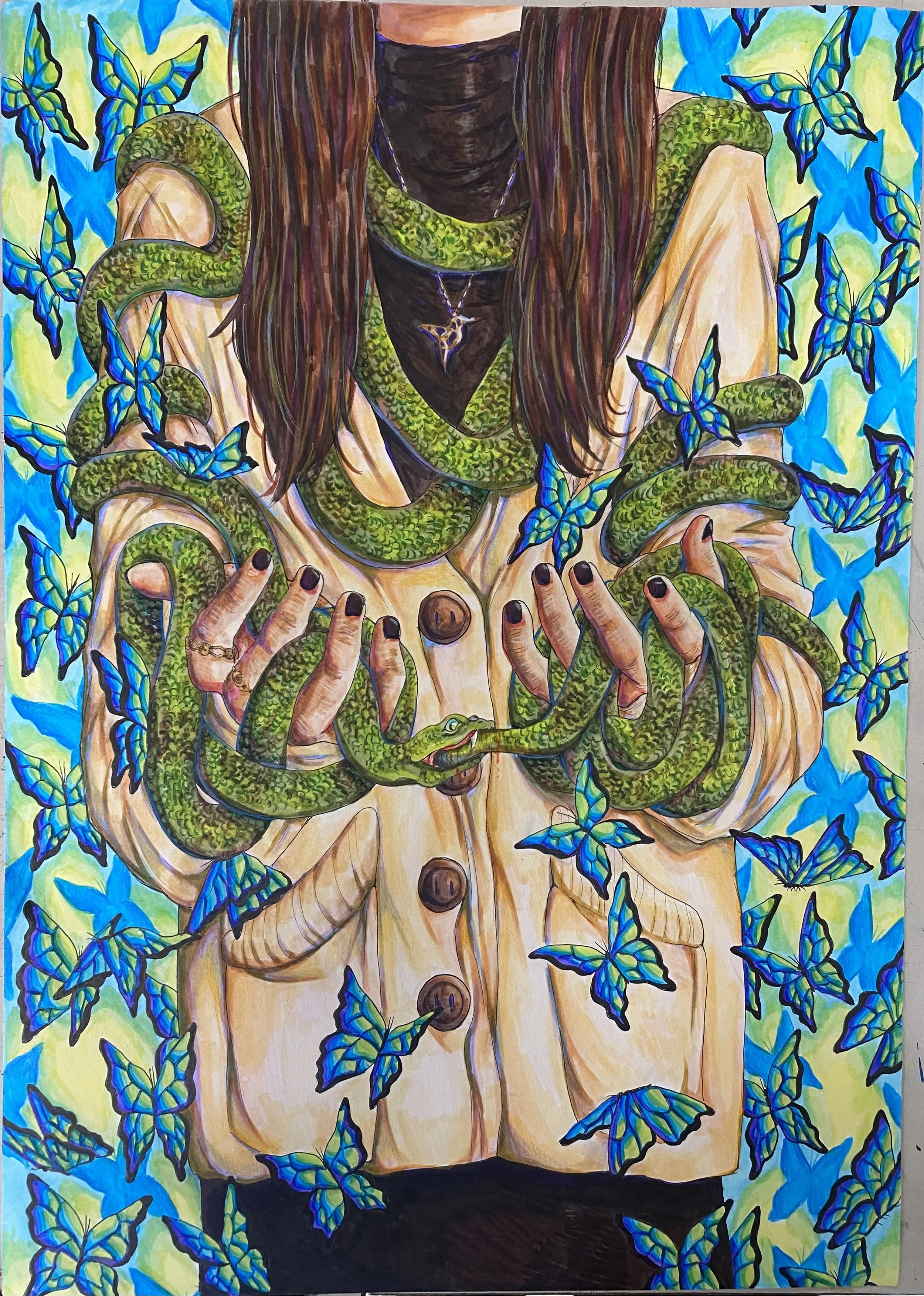 A person with long brown hair is surrounded by green snakes and blue butterflies, holding a snake in their hands. They wear a tan coat with black buttons and a necklace with a triangle pendant.