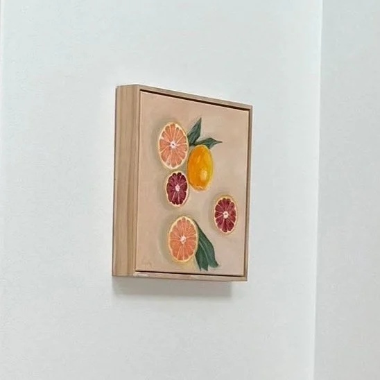 'Vitamin C' oranges painting framed and hanging in home