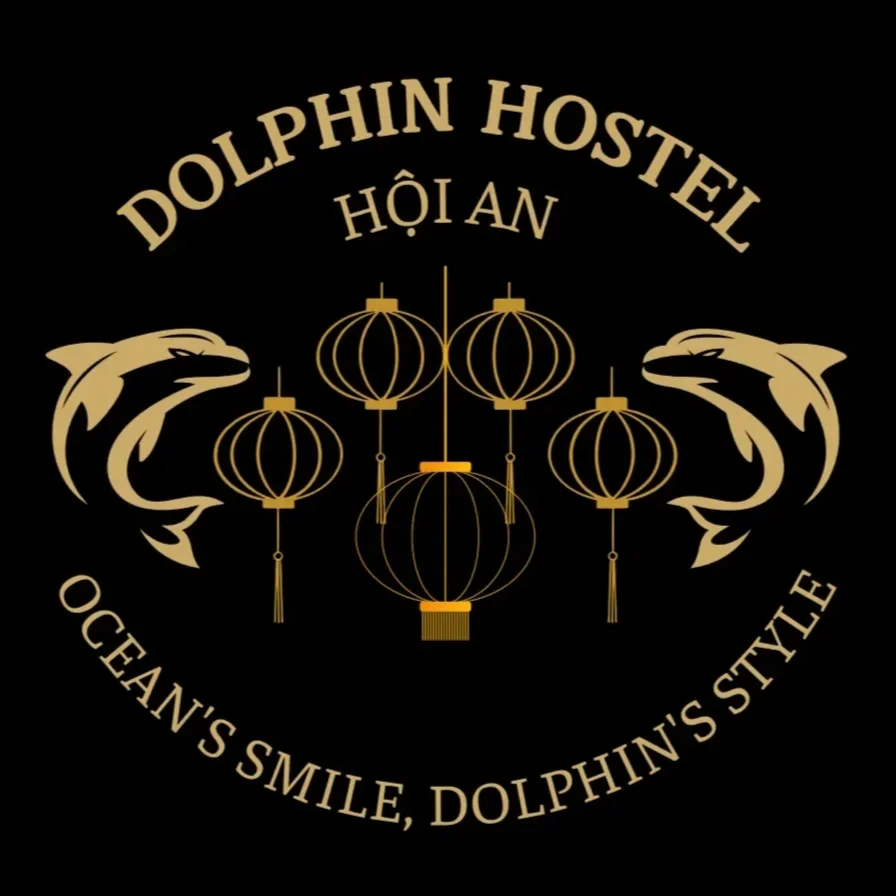 Black background logo for Dolphin Hostel featuring two dolphin illustrations, five hanging lanterns, and text in gold that reads 'DOLPHIN HOSTEL,' 'HỘI AN,' and 'OCEAN'S SMILE, DOLPHIN'S STYLE.'