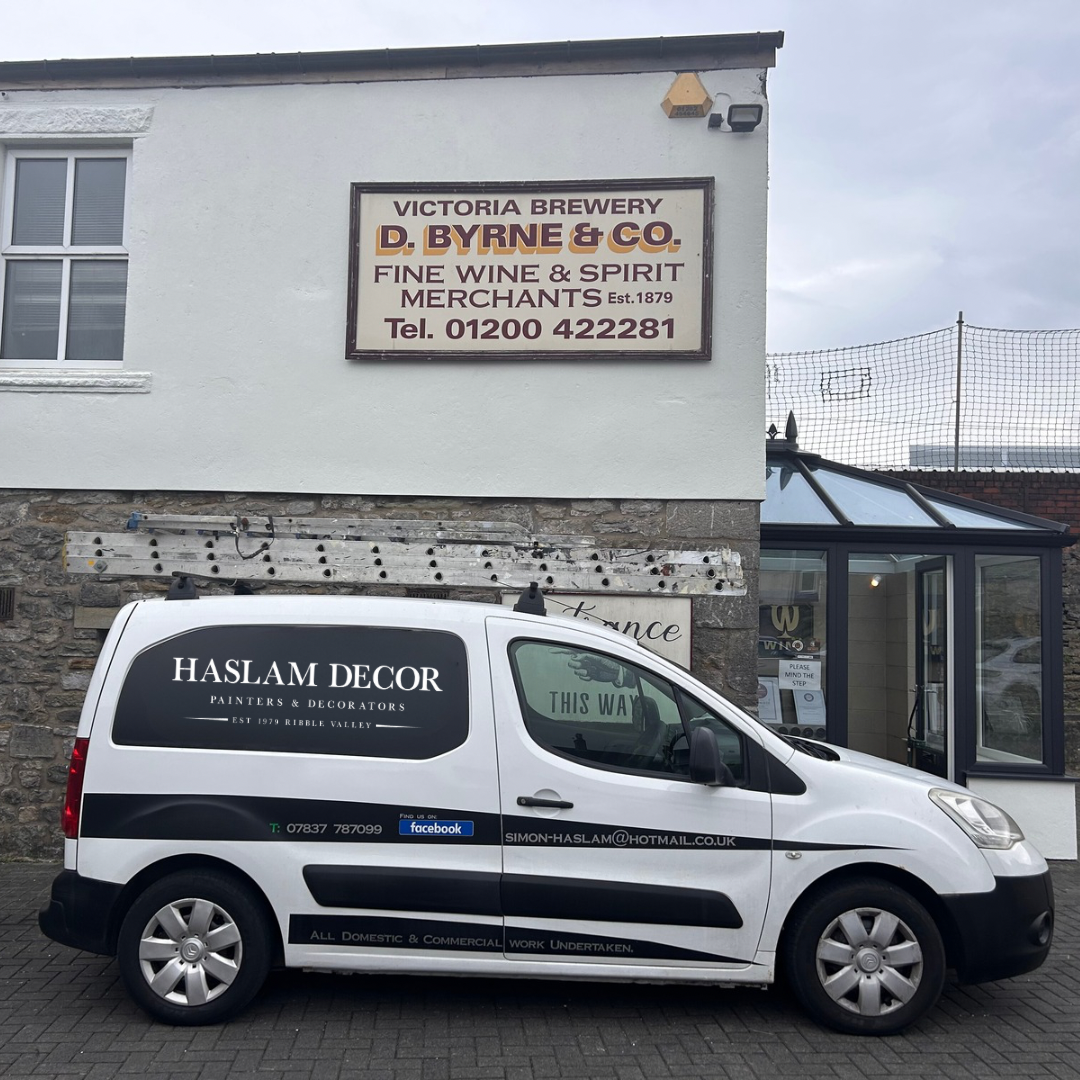 Haslam Decor van parked outside a commercial property in Ribble Valley, showing company branding and contact details — trusted local painting and decorating services.