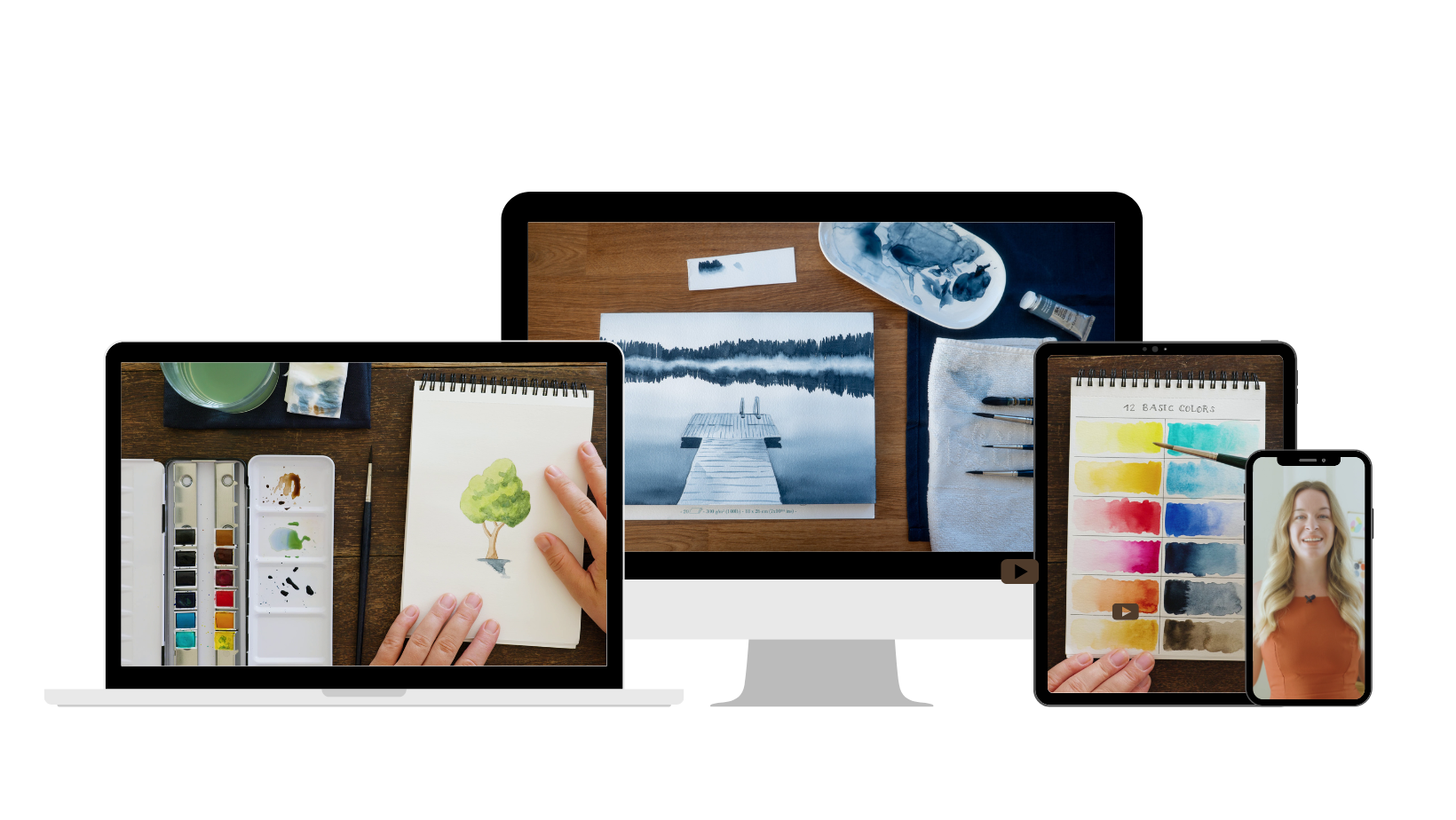 Collage of digital devices displaying creative art projects: a laptop with a watercolor painting of a tree, a tablet with a watercolor palette and a color chart, a desktop monitor with a drawing of a dock on a lake, and a smartphone showing a smiling woman.