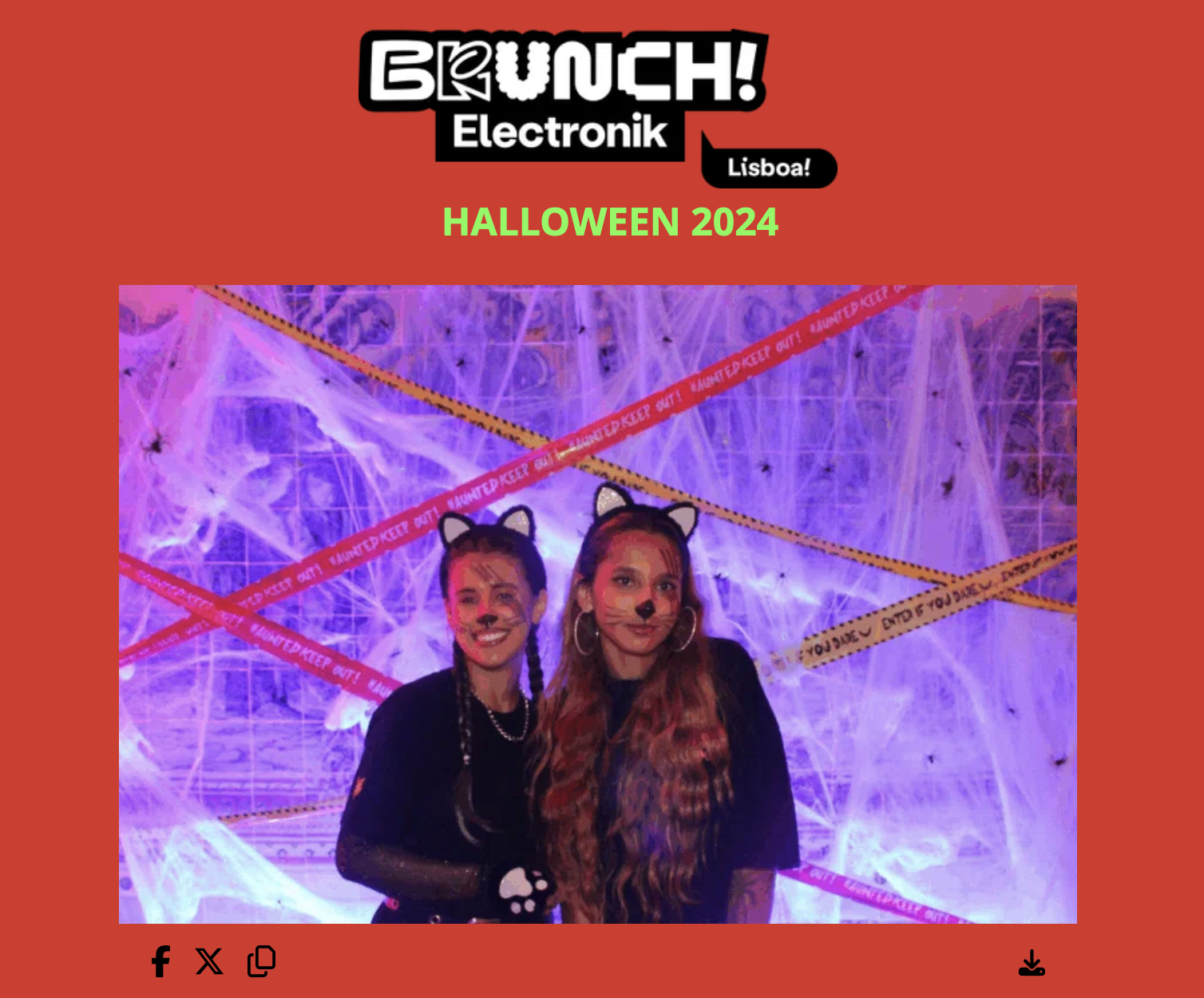 Two women with Halloween face paint and cat ear headbands at a Halloween-themed event, with a purple spider web backdrop and caution tape decorations.