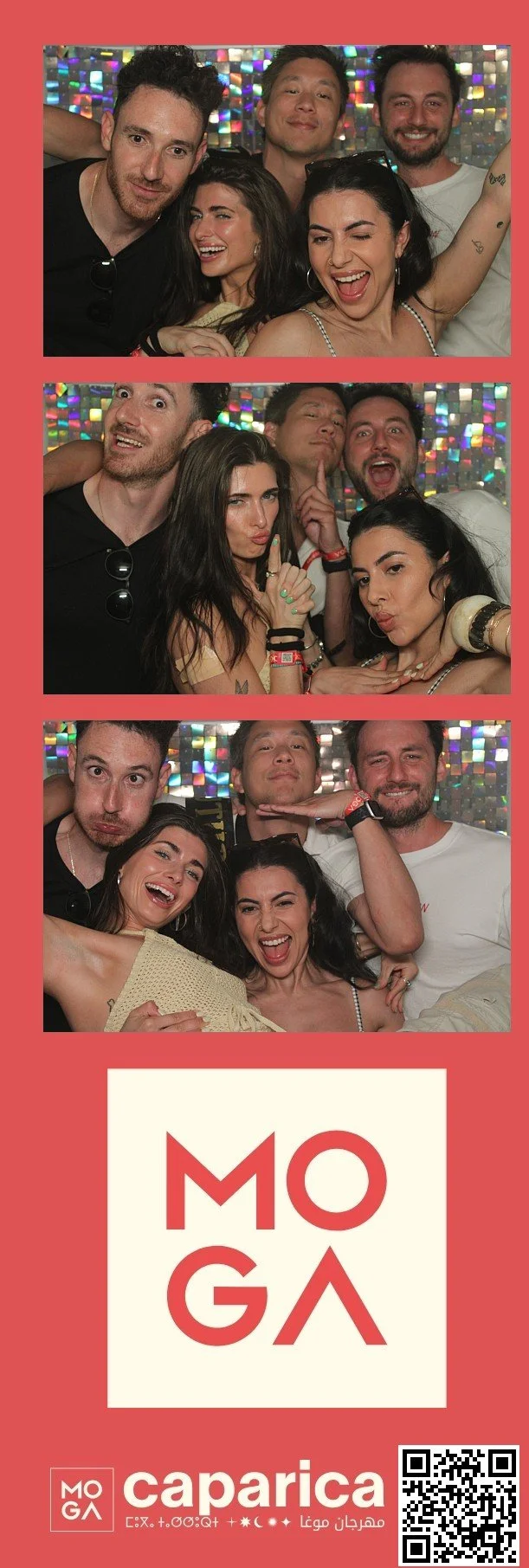 Group of six friends posing for fun photos at a celebration, with a colorful, iridescent background and a red border, featuring the logo 'MOGA' and event details at the bottom.