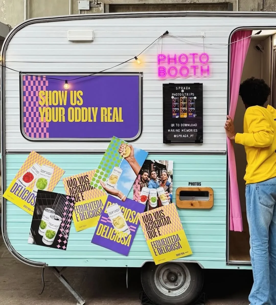 Group of six friends posing for fun photos at a celebration, with a colorful, iridescent background and a red border, featuring the logo 'MOGA' and event details at the bottom.