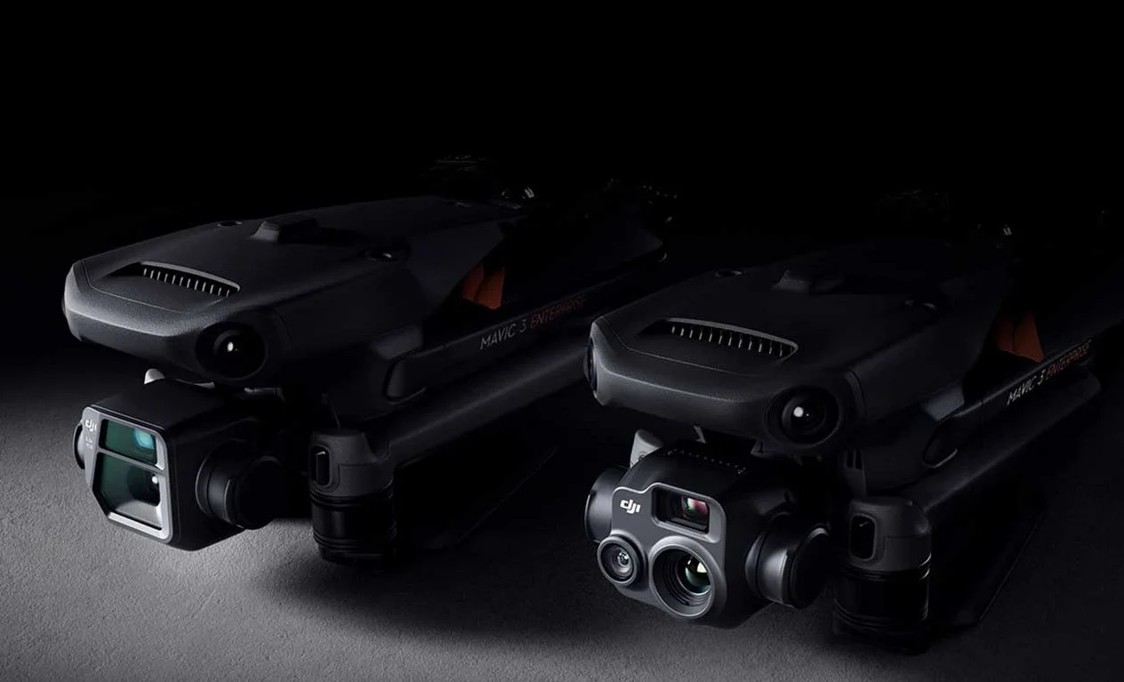 Two DJI Mavic 3 Enterprise drones with advanced cameras on a dark background.