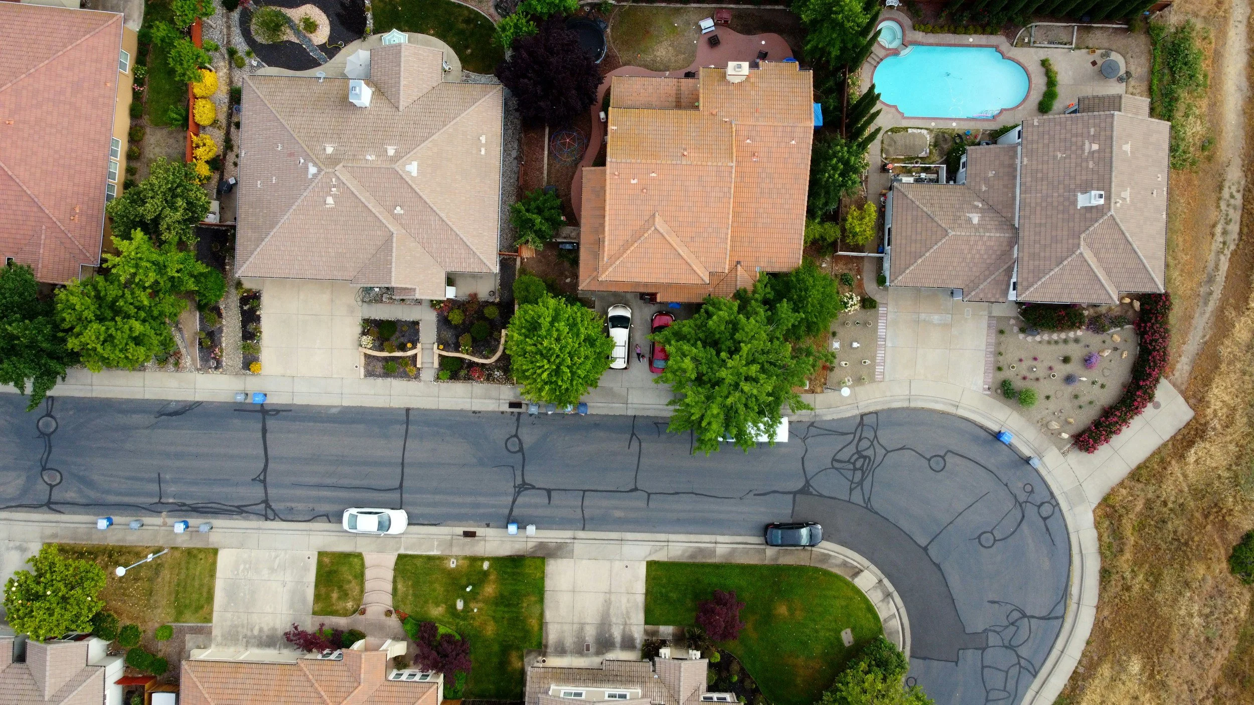 drone overhead three houses