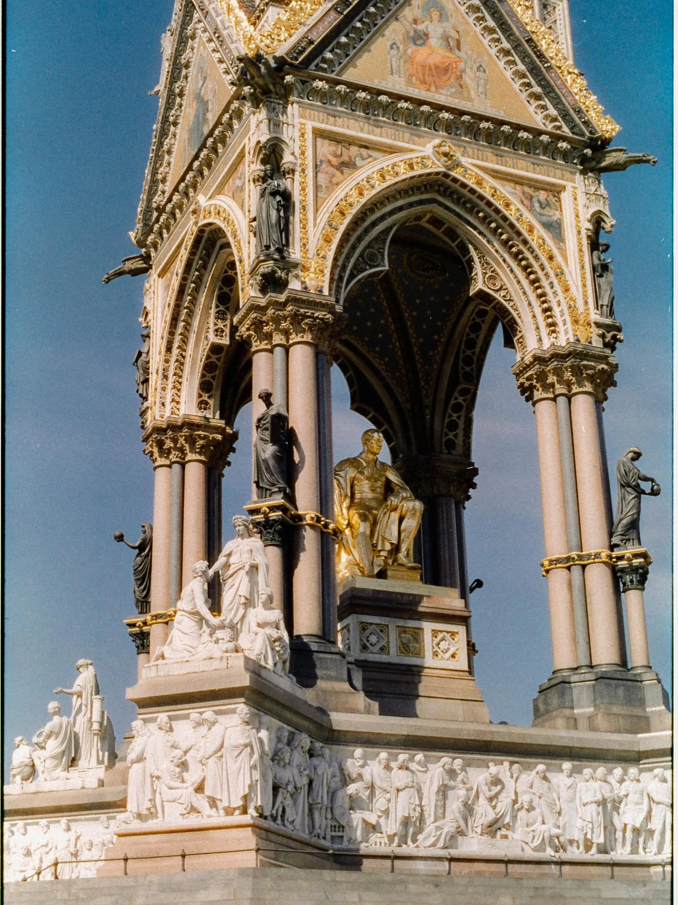 So, the Albert Memorial. Sitting out there in Kensington Gardens looking aggressively golden because the London sky actually decided to show up for work.
I shot this on Harman Phoenix 200, which is an interesting beast. It&rsquo;s got this specific, 