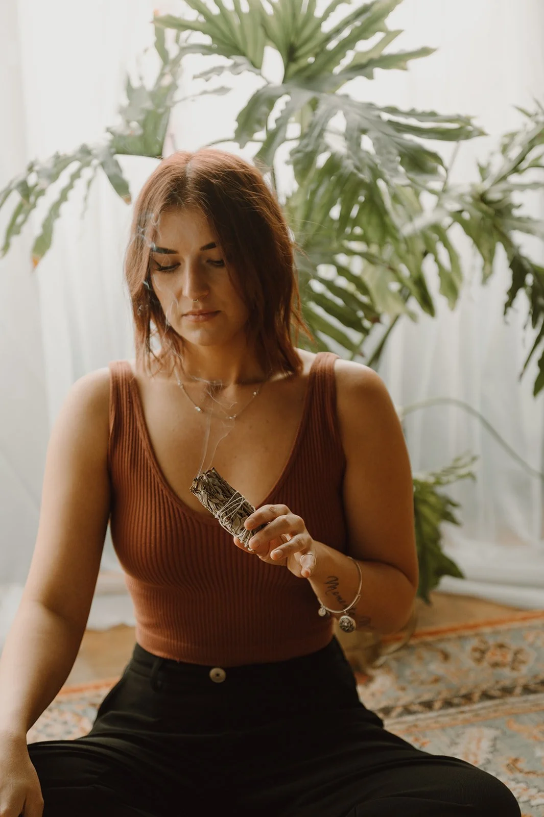 Tora Savage cleansing with sage