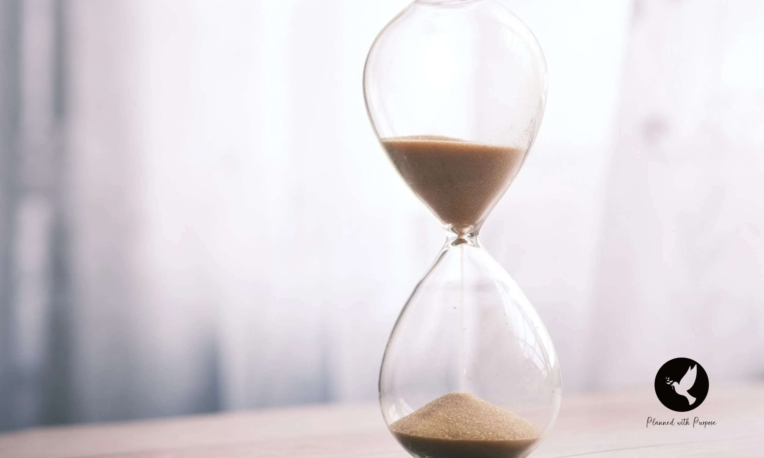 Hourglass and the Planned with Purpose Logo