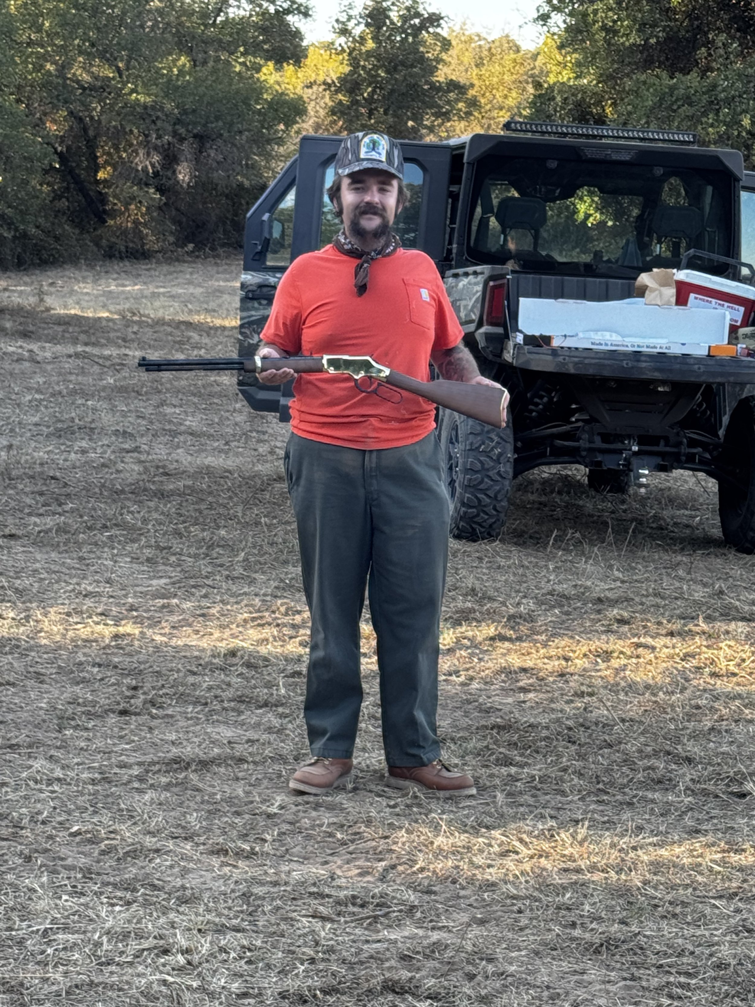 Enjoying a moment of skill and tradition, Tanner holds a classic rifle during an outing at the Essex Ranch shooting range. The backdrop of nature and the spirit of adventure make this day unforgettable.