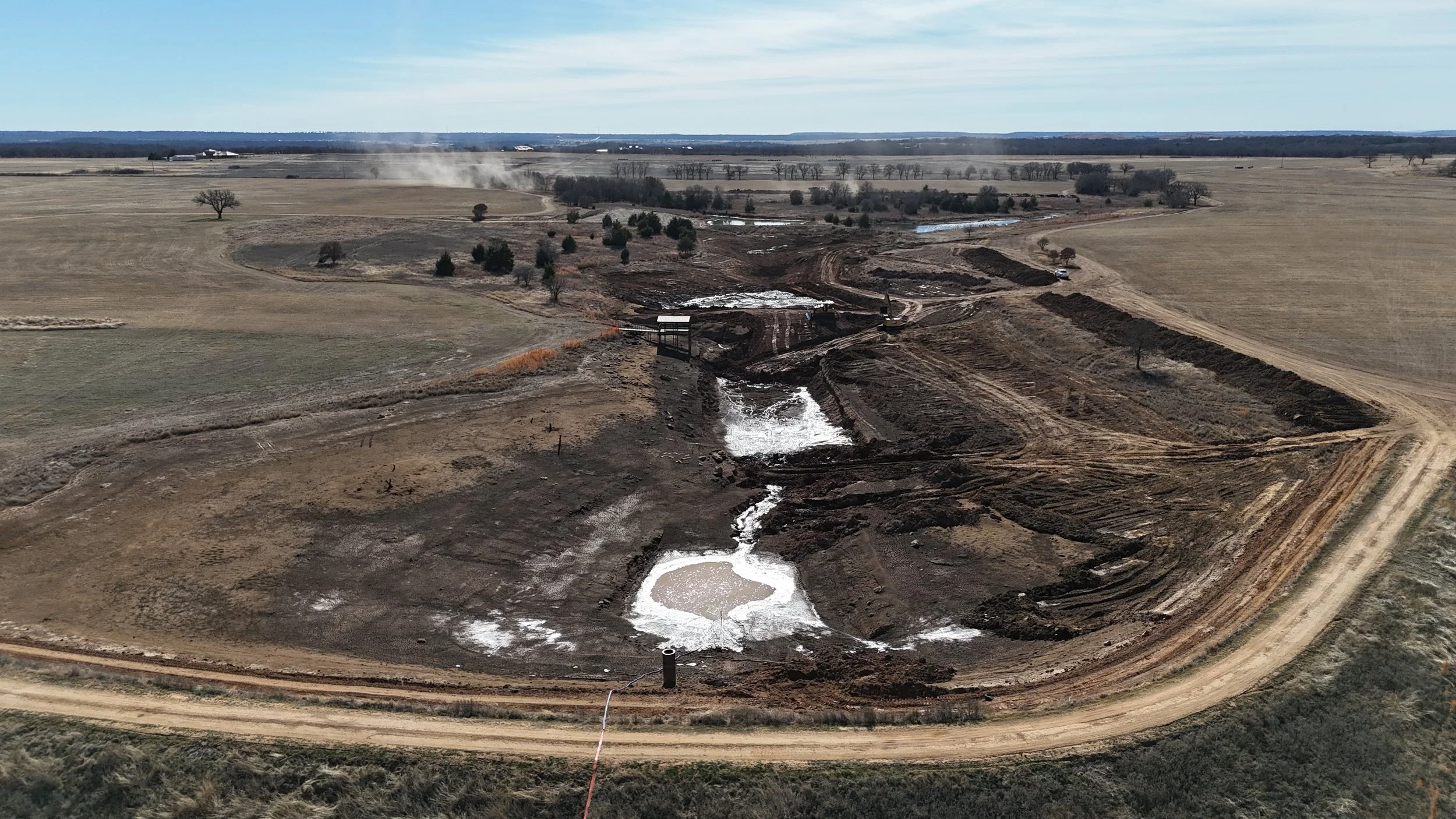 Aerial view of the drained Main Lake at The Essex Ranch during excavation and reconstruction.