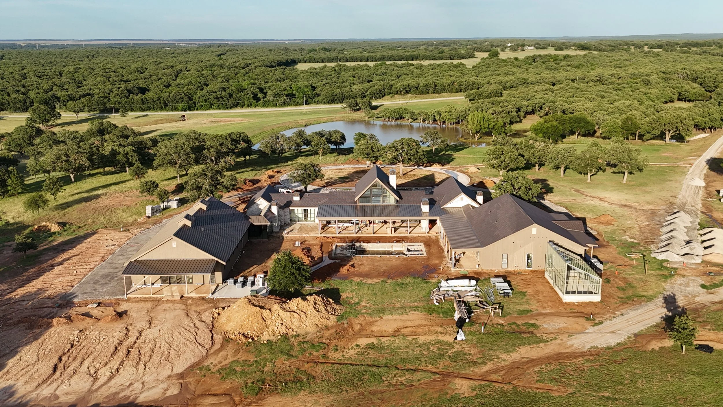 Aerial view of the future backyard and outdoor living spaces at The Essex Ranch.
