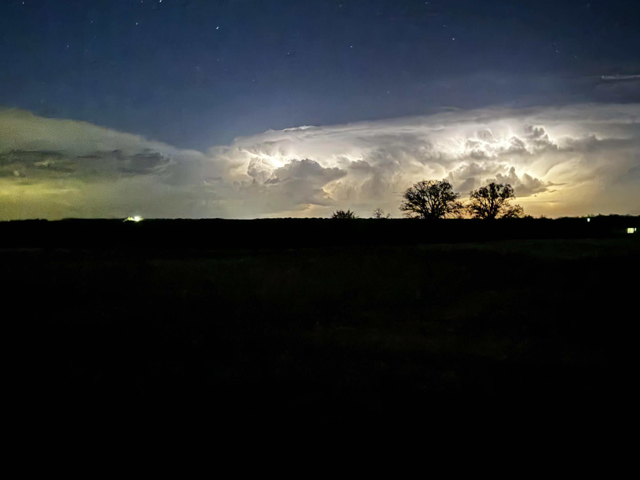 A distant storm lights up the night sky, revealing the quiet power and beauty of nature’s design. Captured at The Essex Ranch, these moments reflect the sky in motion—bold, silent, unforgettable.