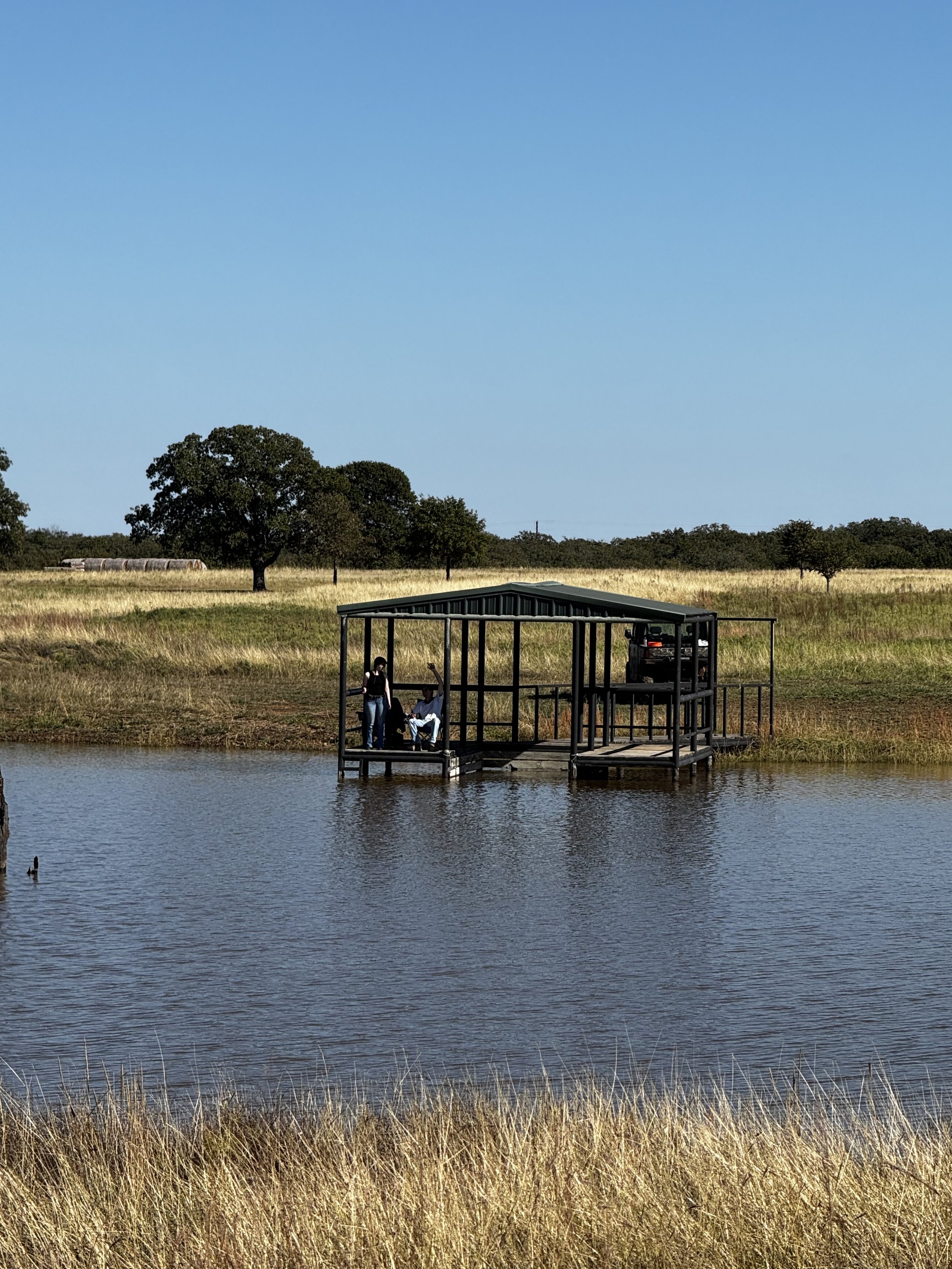 Megan and Angel spending a peaceful afternoon fishing at the boat dock. This serene moment captures the simple joys of being surrounded by nature and creating memories together.