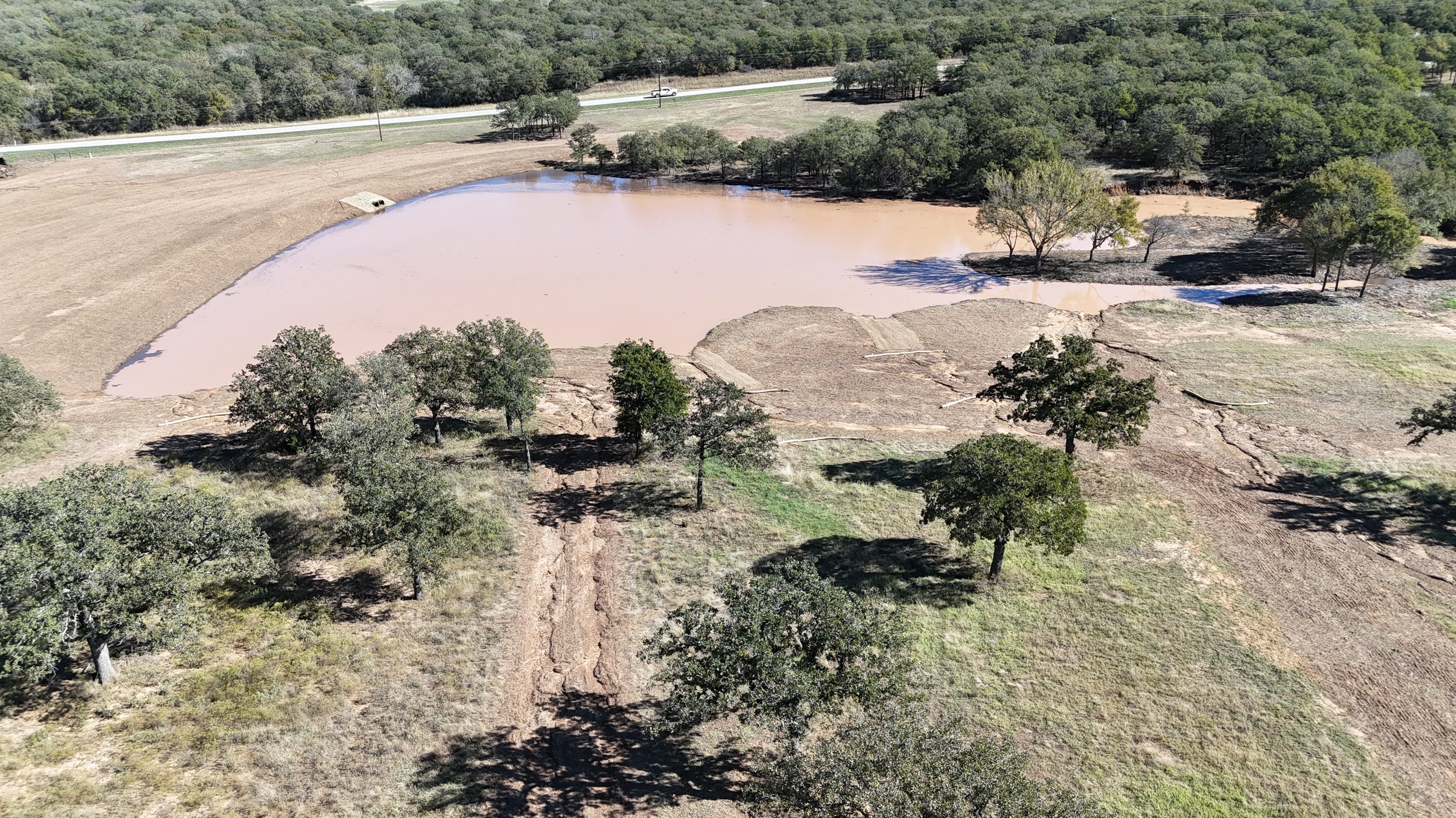 After heavy rains, the new lake at Essex Ranch fills up, blending perfectly into the natural landscape. This serene addition not only enhances the property’s beauty but also promises a peaceful retreat surrounded by nature.