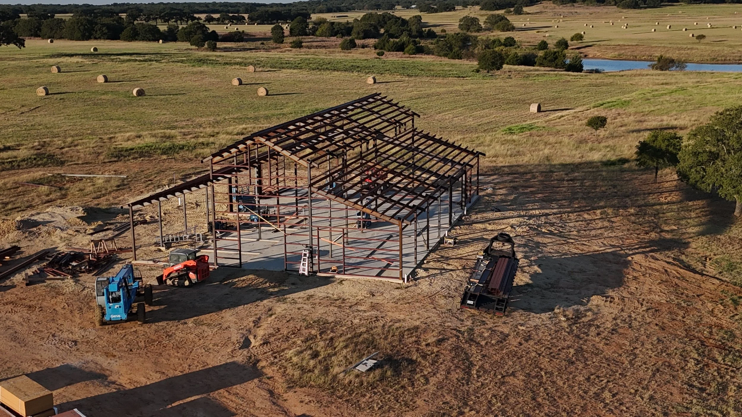 Construction underway on the barn, setting the stage for future ranch projects.