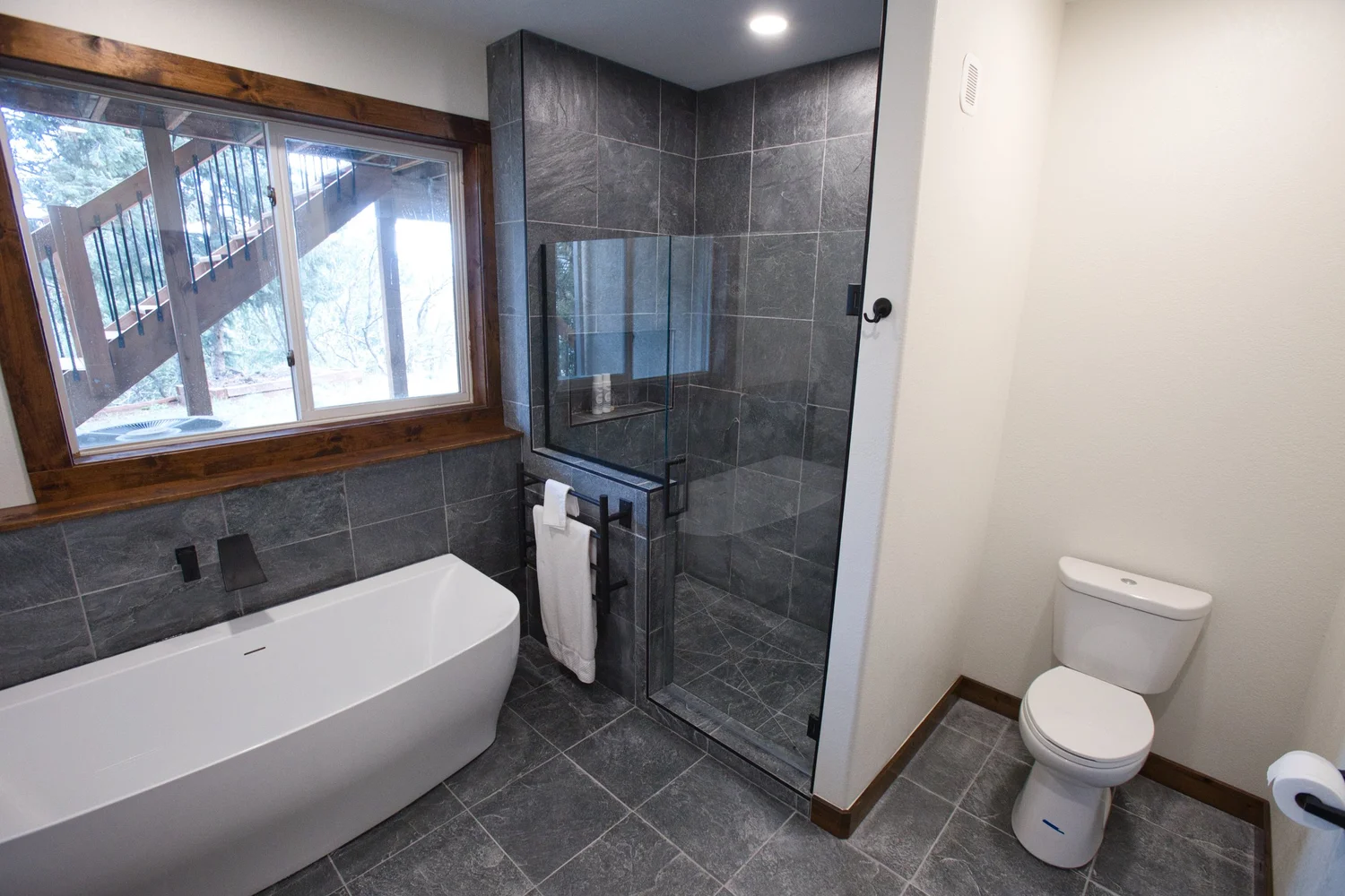 Luxury bathroom renovation with custom tile