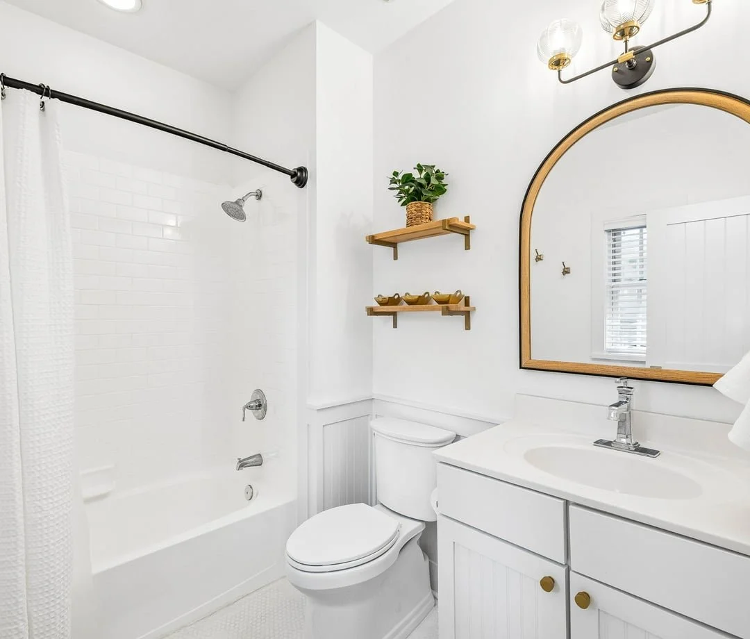 Bathroom with brass mirror at The Big Sea, a 30A vacation rental in Seacrest Beach, FL