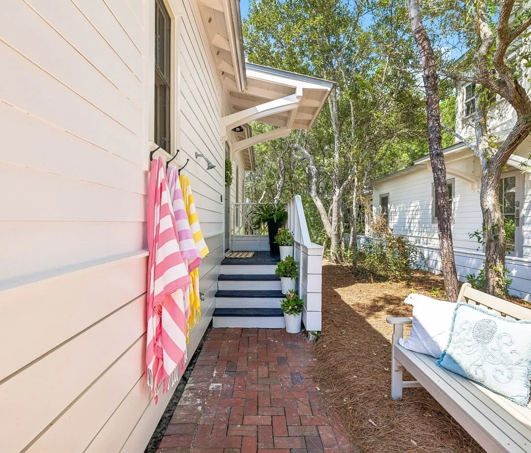 Side porch with bench at The Big Sea, a 30A vacation rental in Seacrest Beach, FL