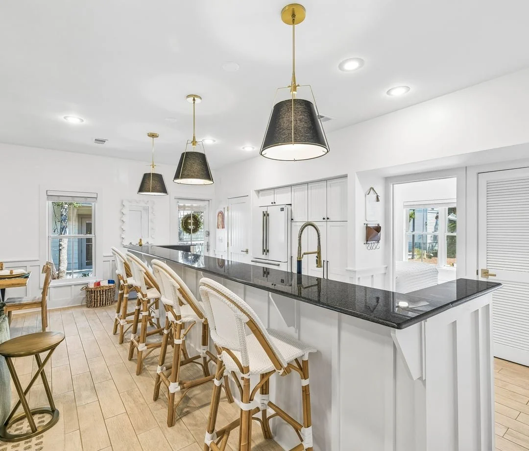 White kitchen with pendant lights at The Big Sea, a 30A vacation rental in Seacrest Beach, FL