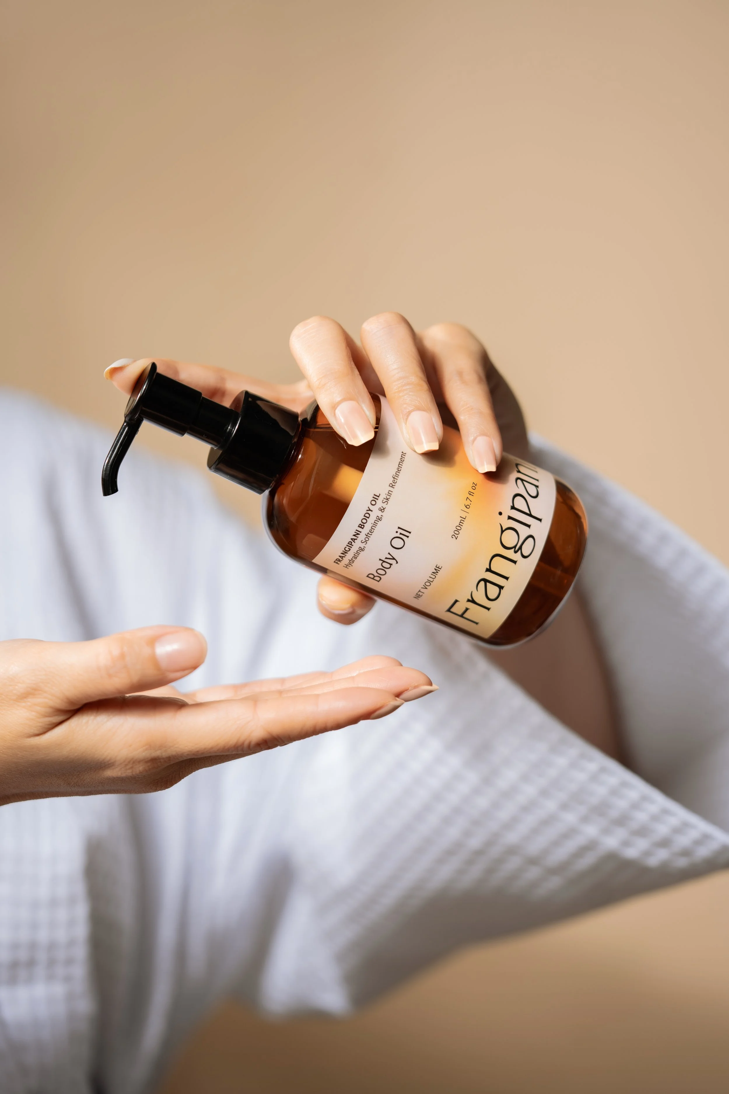 Frangipani Body Oil on Hand