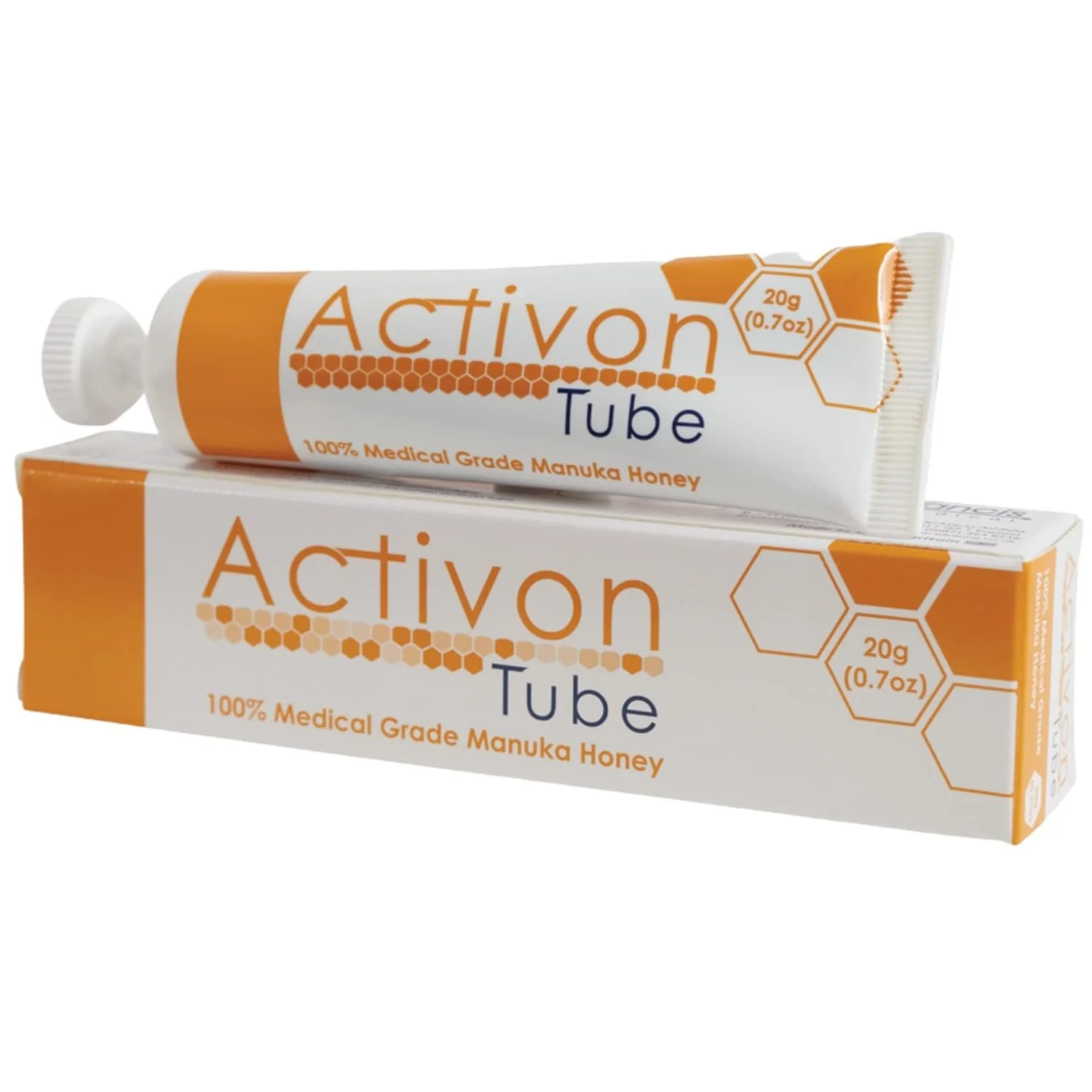 A tube and box of Activon honey ointment, featuring orange and white packaging with honeycomb graphics and text indicating 20 grams of medical grade Manuka honey.