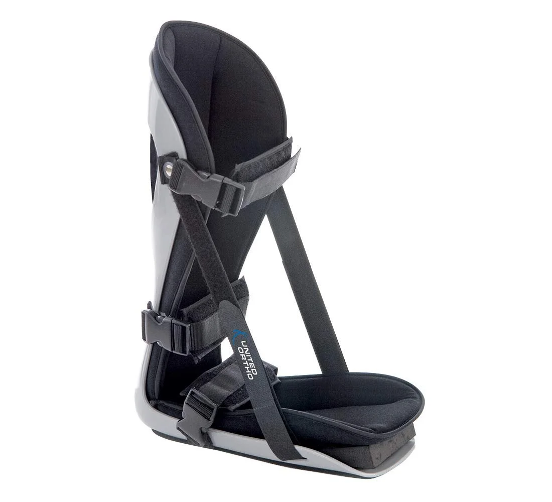 Black and white night splintwith straps and padding.