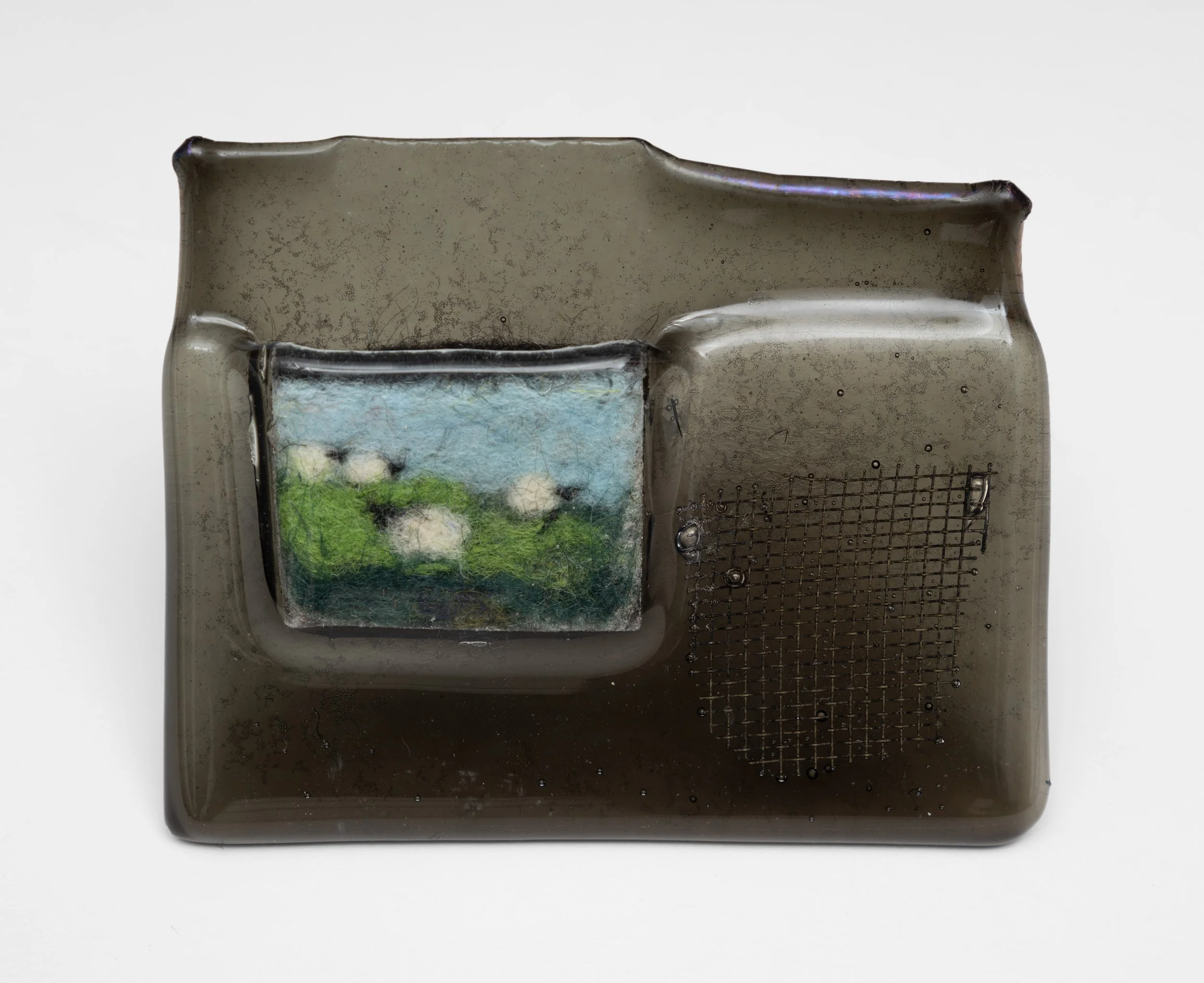 Talisman
Fused glass, needle felted wool on industrial felt and copper mesh
3.5 x 4.5 in
2026