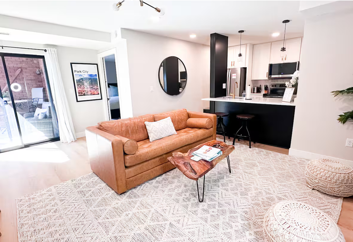 Living room and kitchen in renovated 2-bedroom ski-in/ski-out condo at The Summit at Shadow Ridge in Park City, Utah
