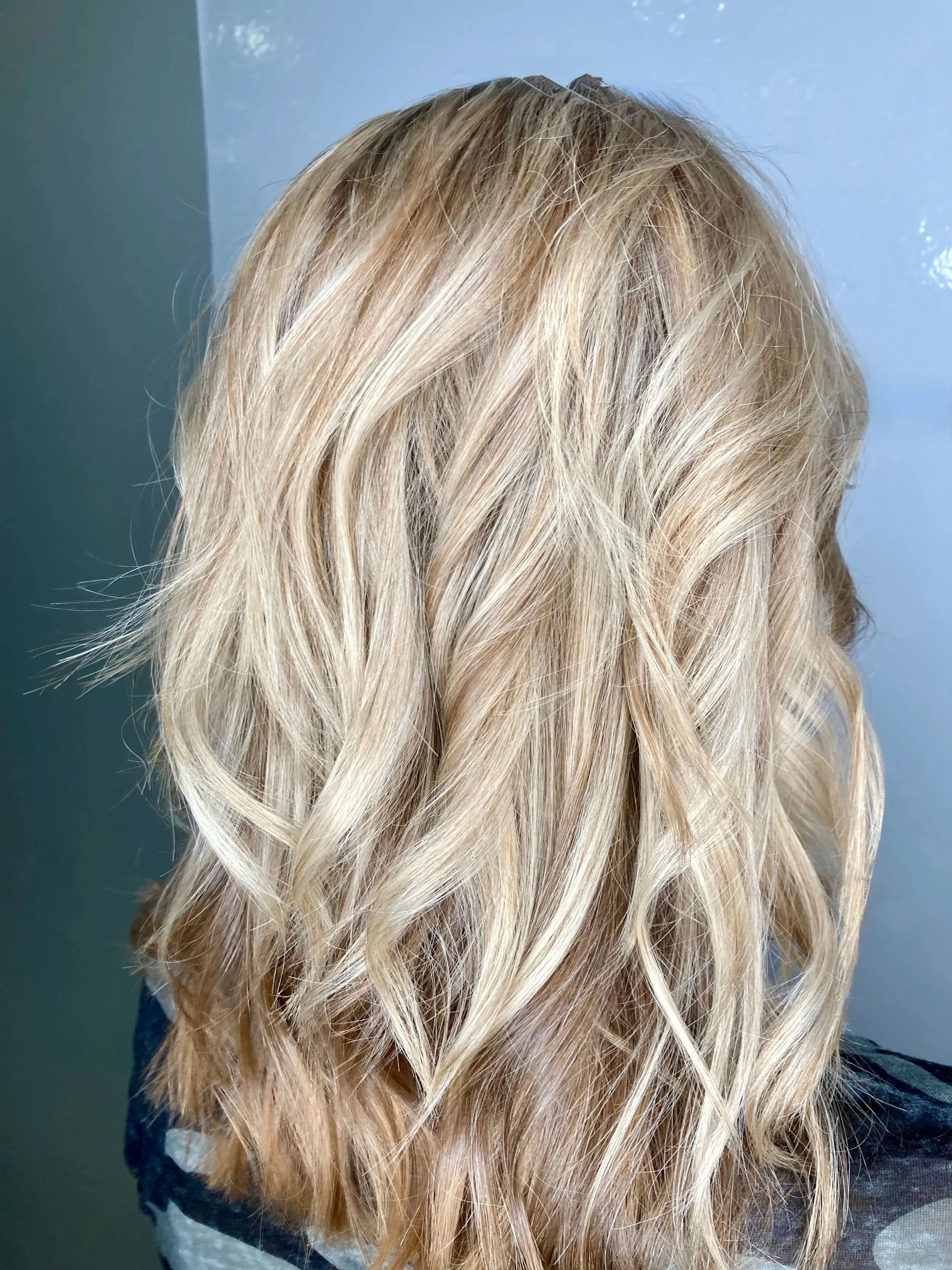 Blonde curly hair viewed from behind