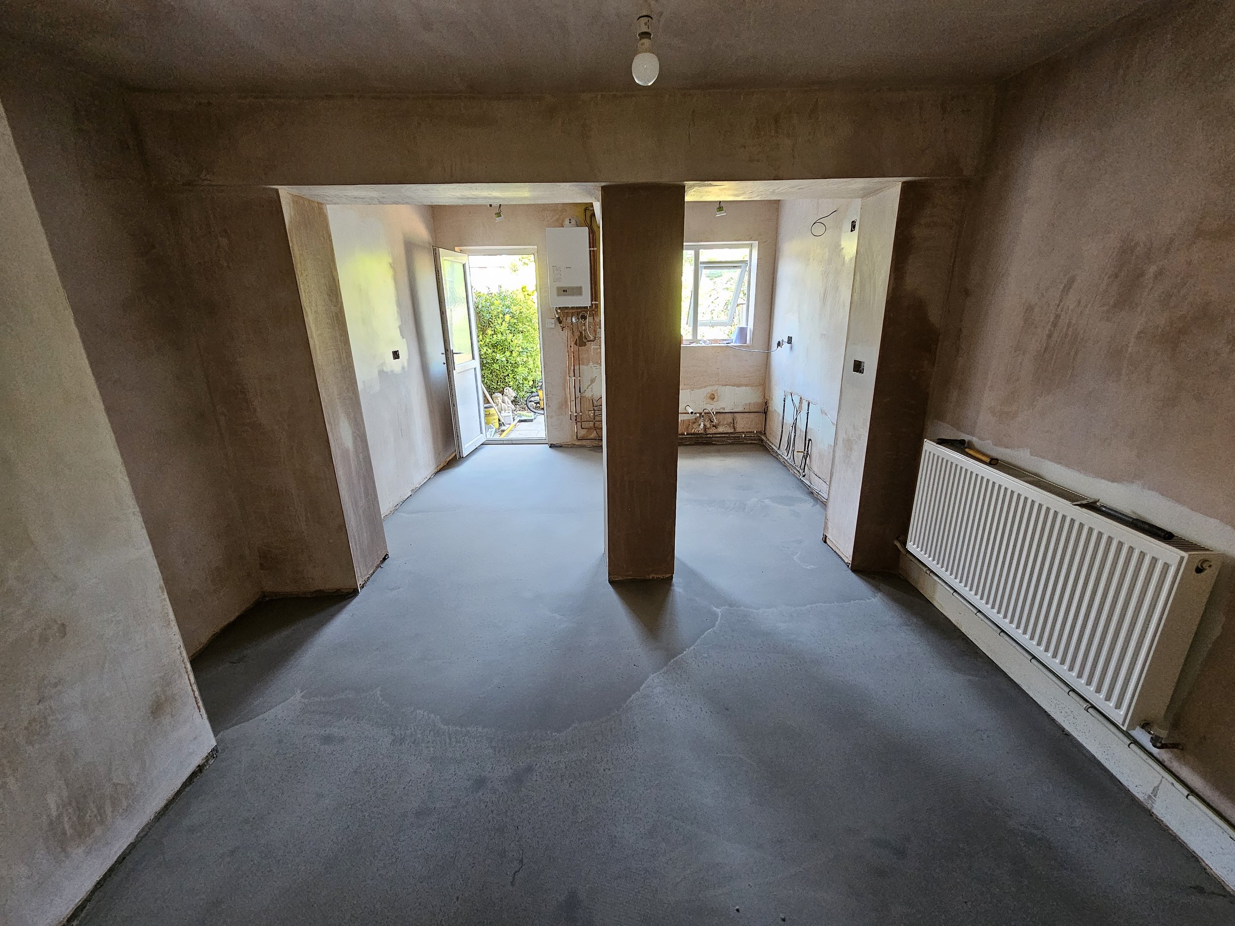 Completely re-plastered the room and self leveled the floor ready for tiling.