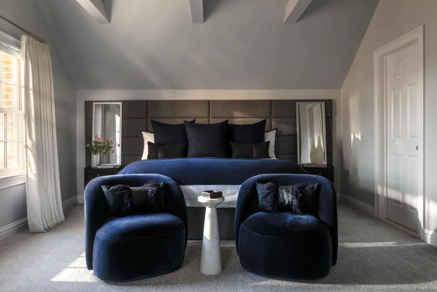 Soft textures and a tailored palette of ink, charcoal, and ivory give this bedroom plenty of presence without sacrificing the sense of calm&mdash;creating a restful space our clients love both waking up in and retreating to at the end of the day. 

?