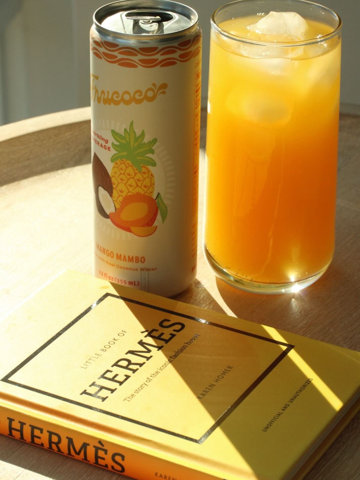 This is your sign to romanticize hydration ✨. Golden hour, a good book, and a clean sips 🥭🥥