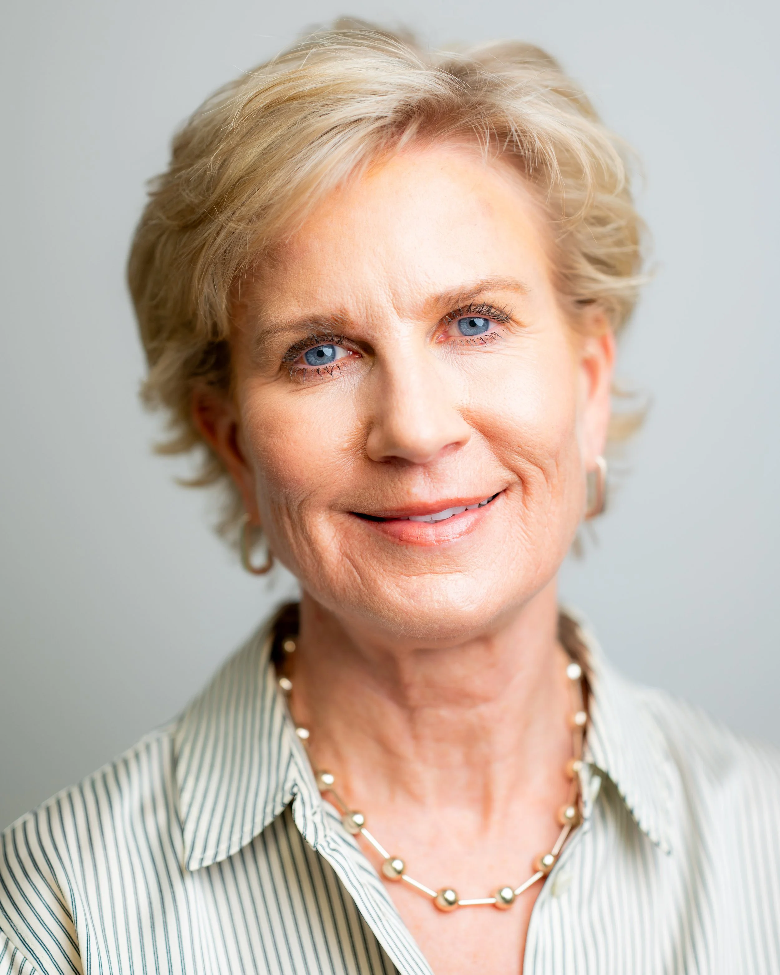 Headshot of Dr. Mary Gingrass of Aesthetic Management Group