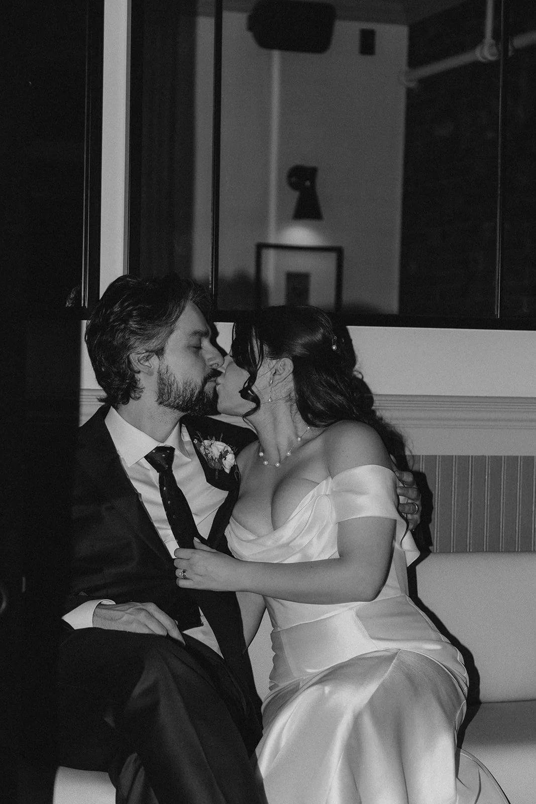 Newlyweds kissing on their wedding day in vintage wedding dress in Ottawa, Ontario