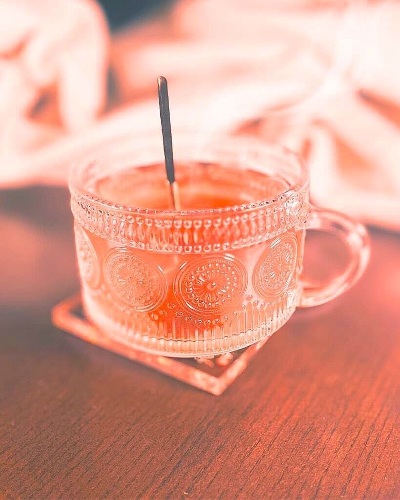 Whisper Herbal Blend tea with a calming mix of lavender, passion flower, chamomile, lemon balm, and ashwagandha, displayed with loose herbs and a serene teacup."