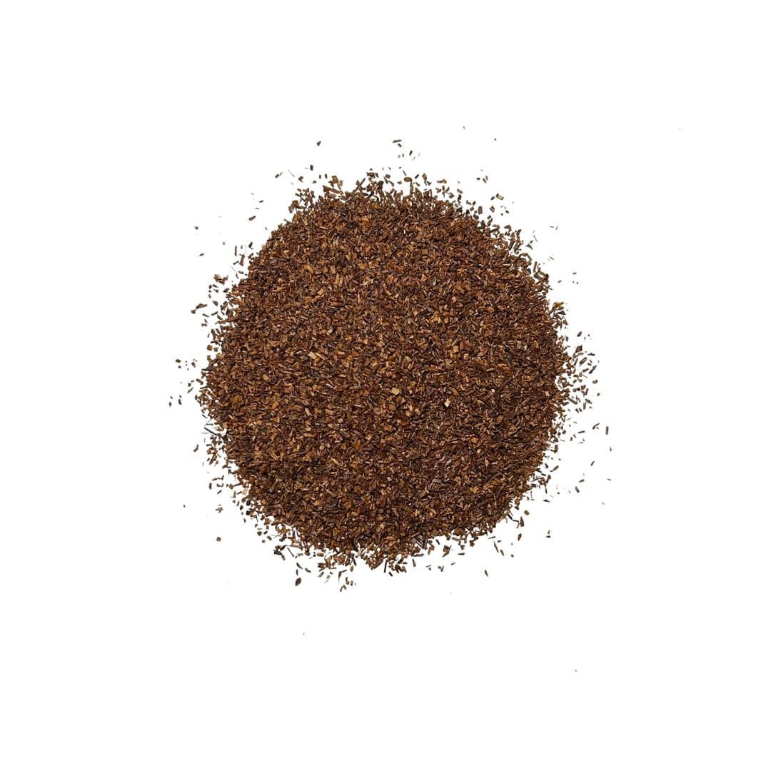 Fine reddish-brown rooibos tea leaves with a rich, earthy, and slightly sweet aroma.