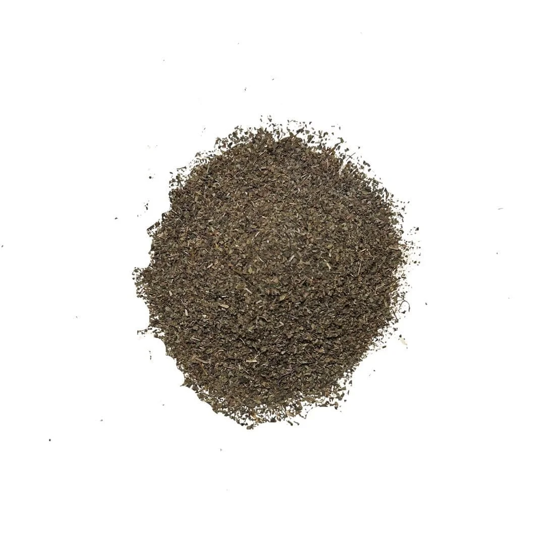Loose leaf Just Holy Basil Tea with aromatic dried Tulsi leaves arranged in a calming, earthy flat lay.