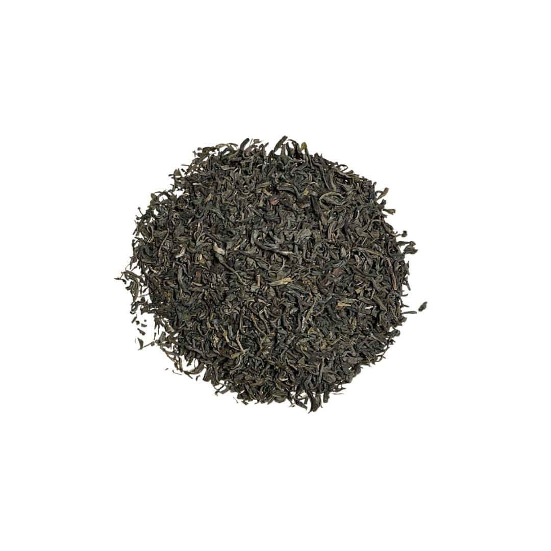 Loose leaf Just Jasmine Tea with beautifully curled jasmine-infused green tea leaves displayed in a soft, serene setting.