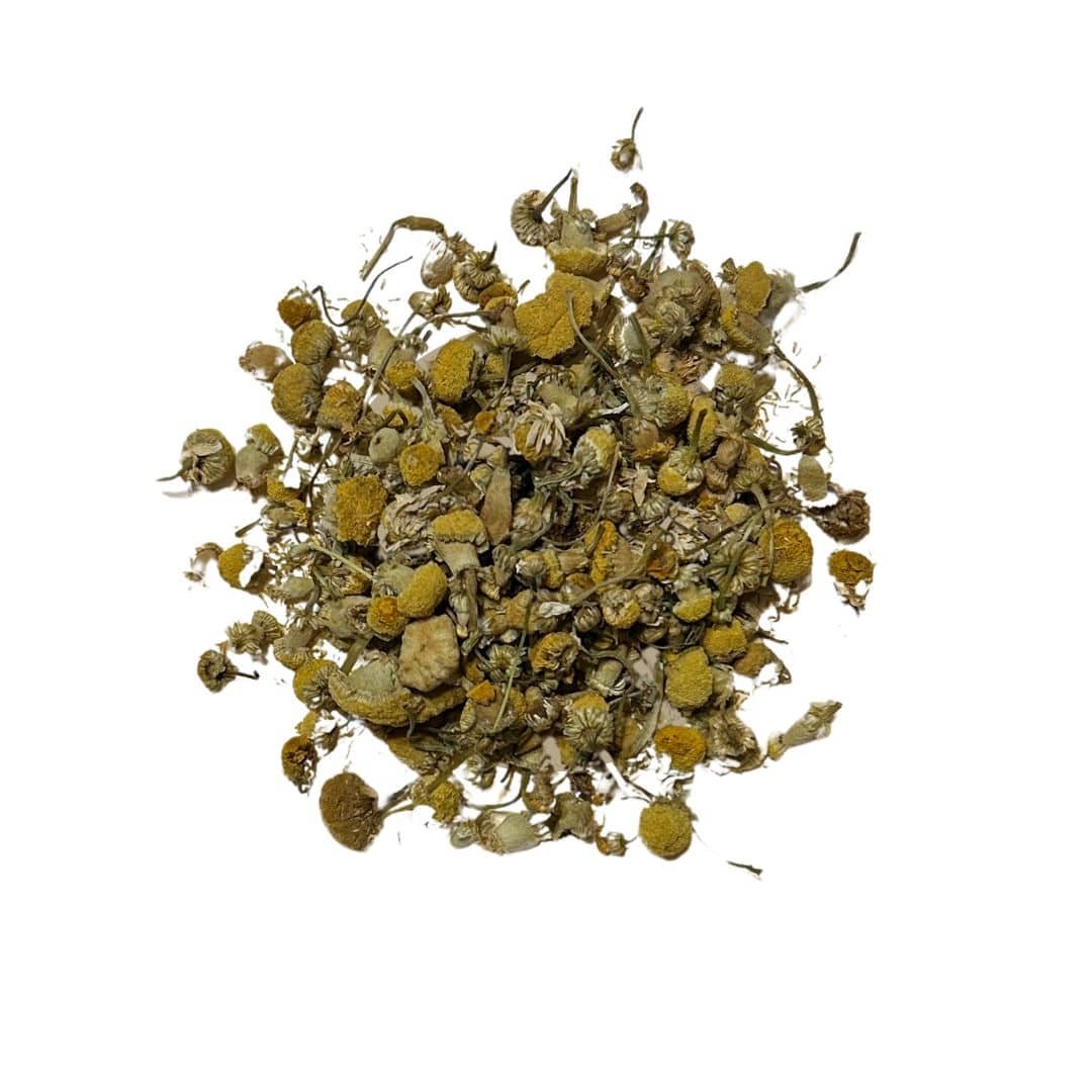 Loose leaf Just Chamomile Tea with golden chamomile flowers displayed in a soft, peaceful setting.